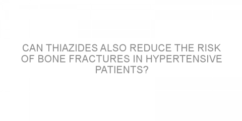 Can thiazides also reduce the risk of bone fractures in hypertensive patients?